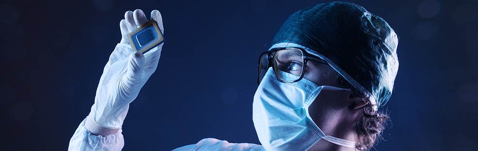 Worker in a laboratory handling nanomaterials.