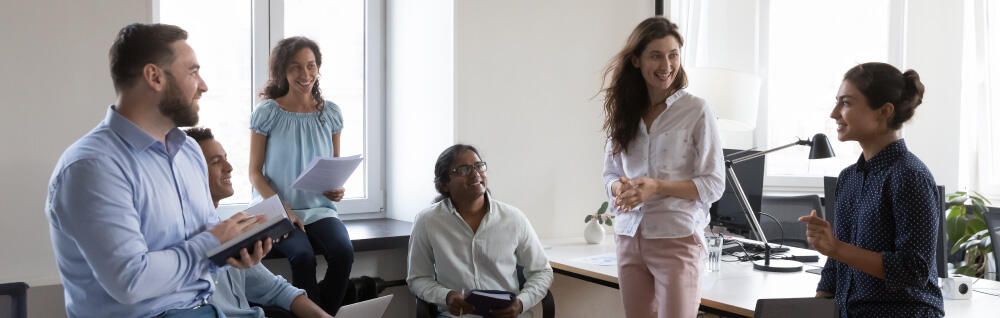 Several young workers in an office