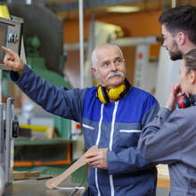 team of engineers having discussion in factory