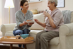 Home caregiver with an elderly woman