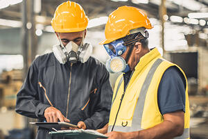 Workers conducting a chemical risk assessment