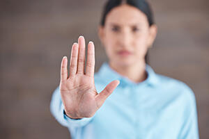 Woman with no gesture for sexual harassment and violence in workplace