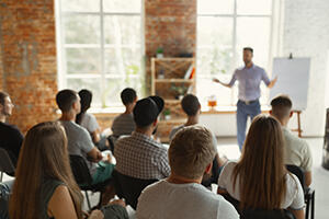 Male speaker giving a presentation