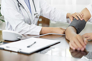 Doctor measuring blood pressure