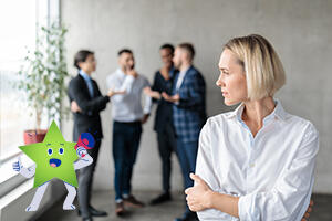 Male coworkers whispering behind back of businesswoman