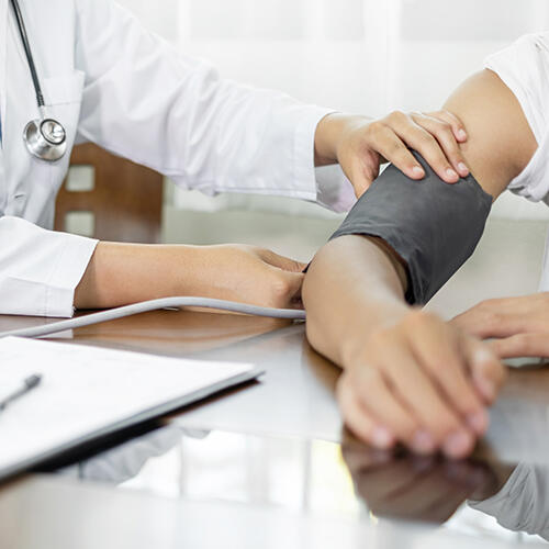 Doctor measuring blood pressure