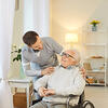 Male nurse providing help to elderly man