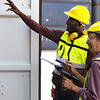 Workers opening a container
