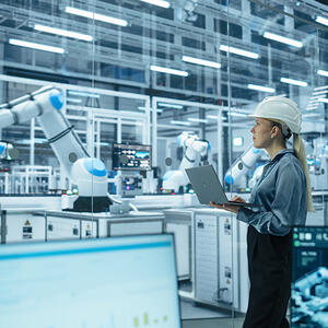 Woman working with robotic arms