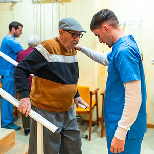 Healthcare worker helping a man