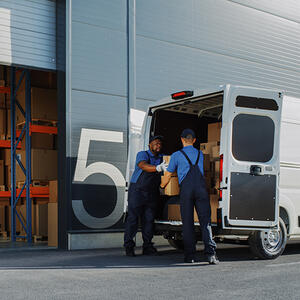 Workers loading delivery truck