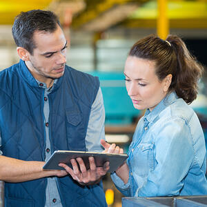 Workers checking a tablet